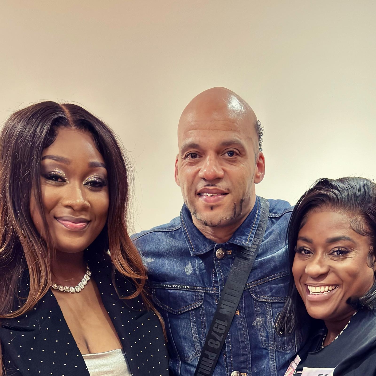 Guests posing with the host backstage at an event